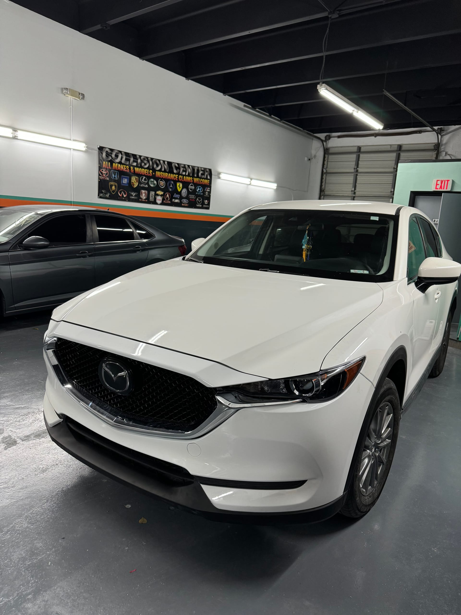 The same CX-5 with a new front end inside the shop