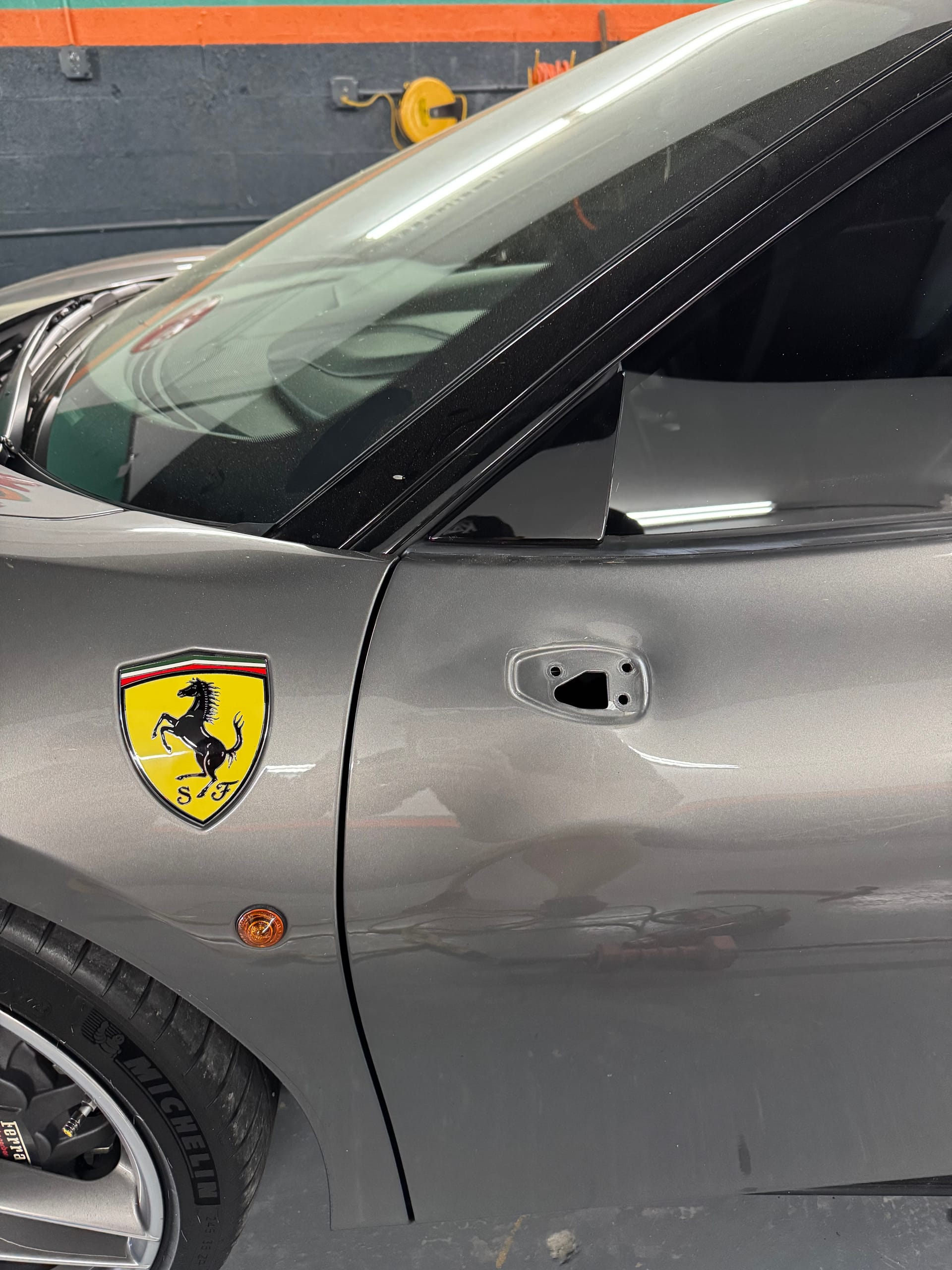 Ferrari 488 door with the handle removed, prepped for paintwork