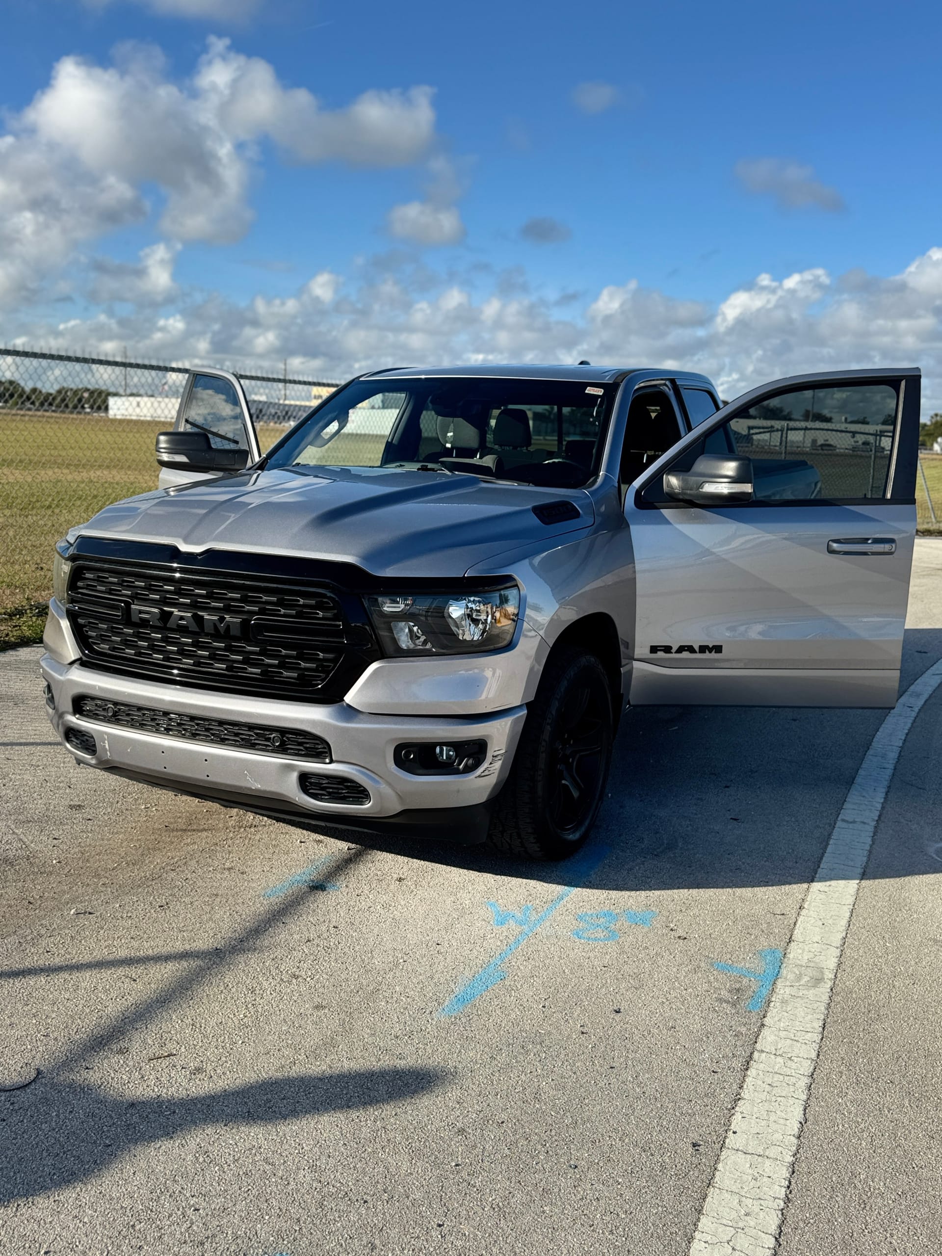 Ram 1500 with a finished front end, photographed outside the shop
