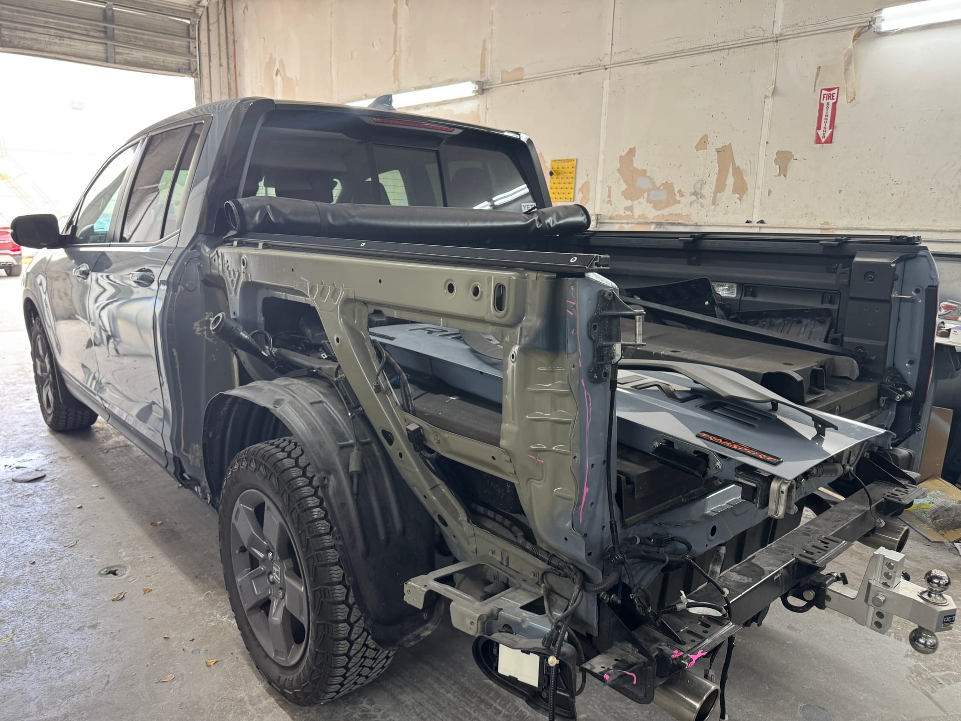 Honda Ridgeline with the bedside panel removed for collision repair