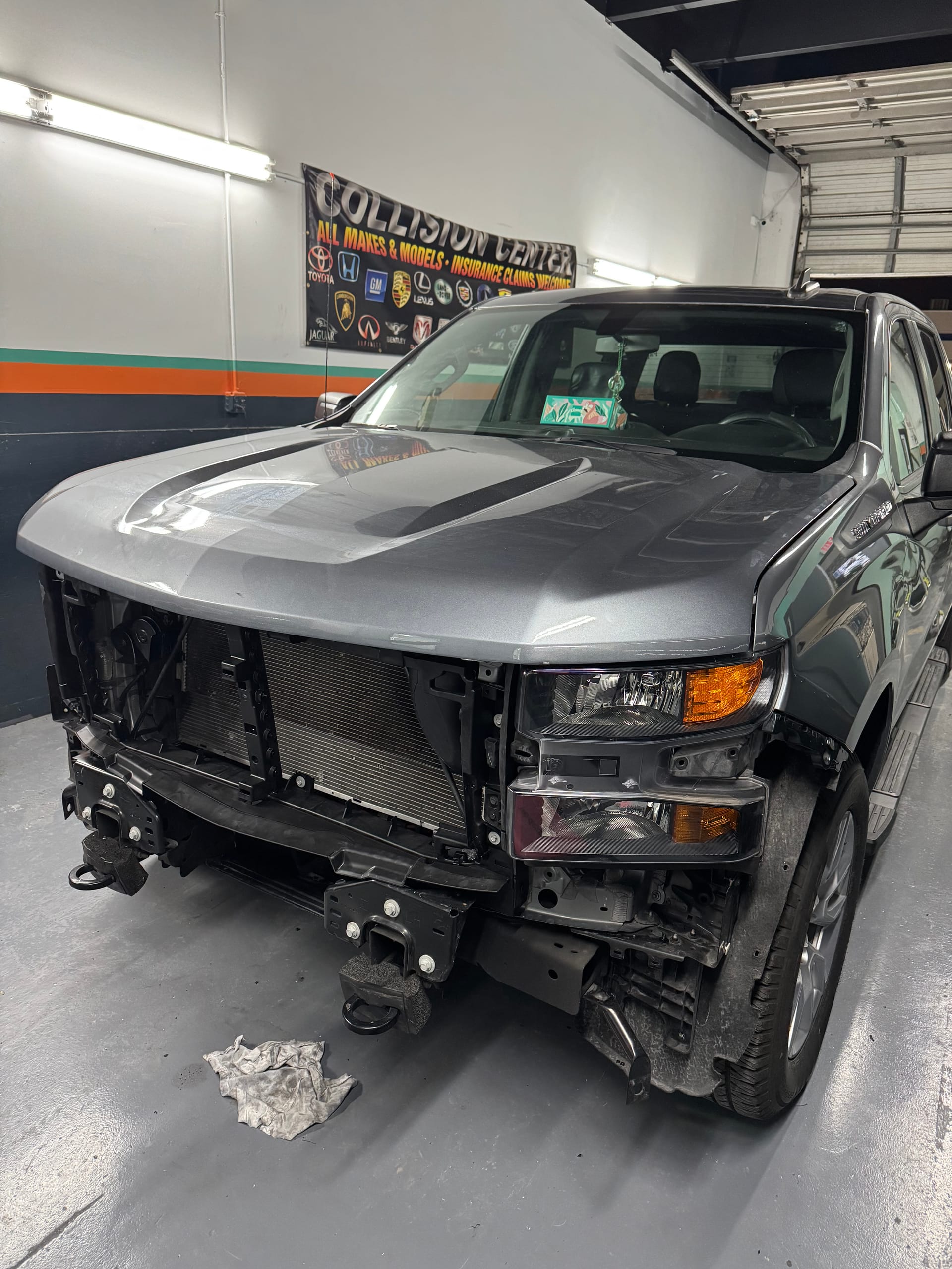 Chevy Silverado with the front bumper, grille and headlight assembly removed