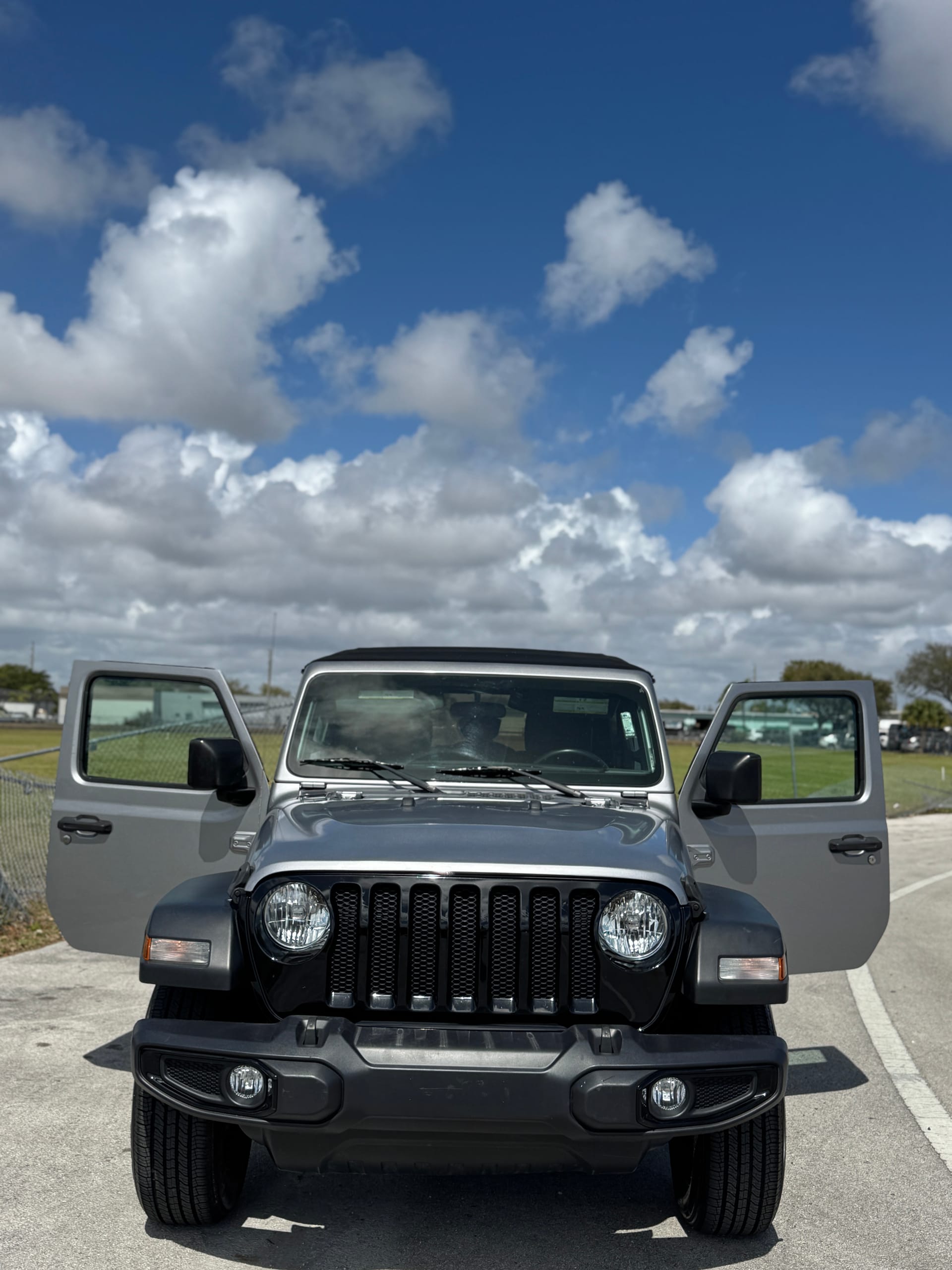 Silver Jeep Wrangler Unlimited, finished, straight-on front view